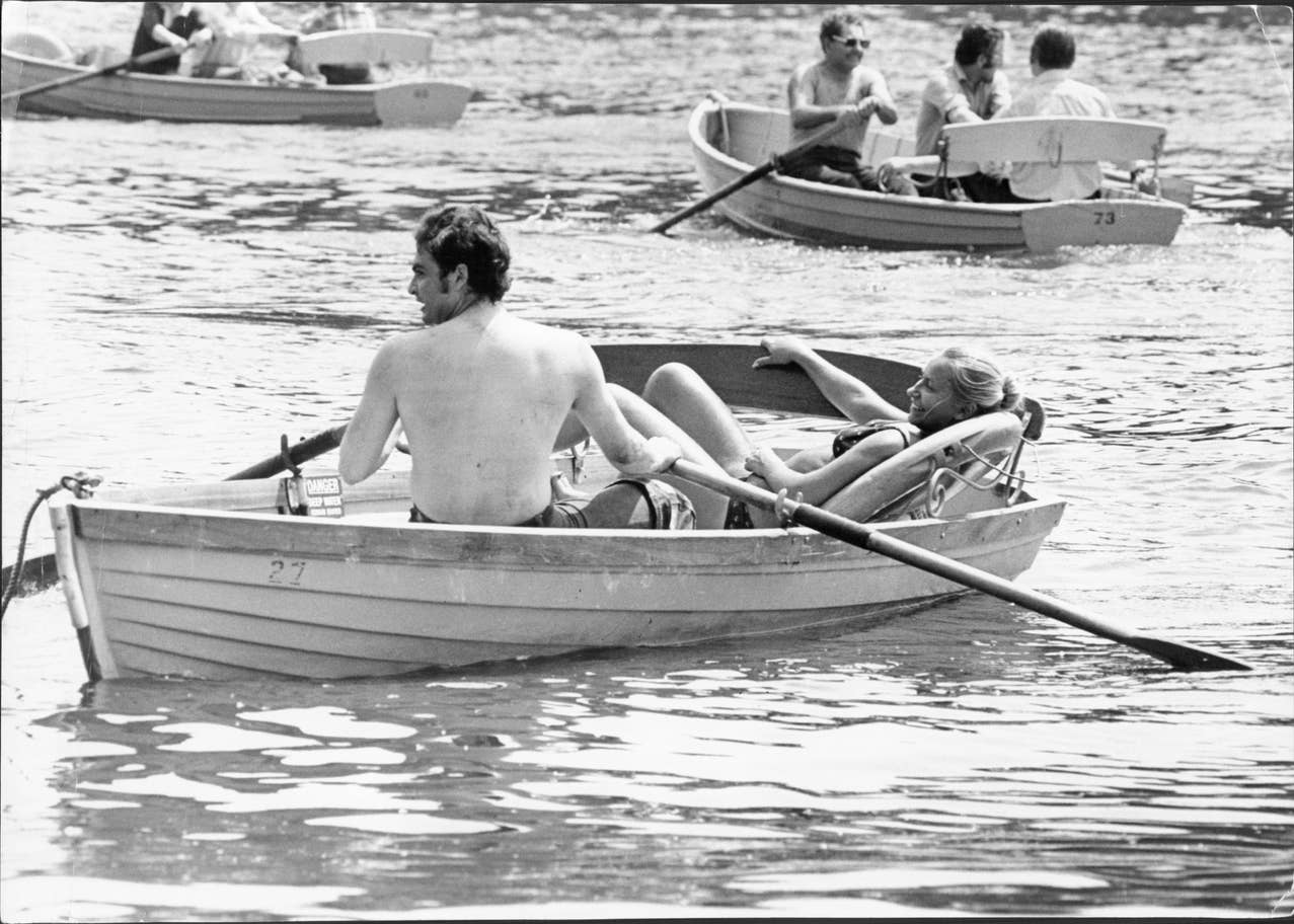 A couple enjoy a boat ride