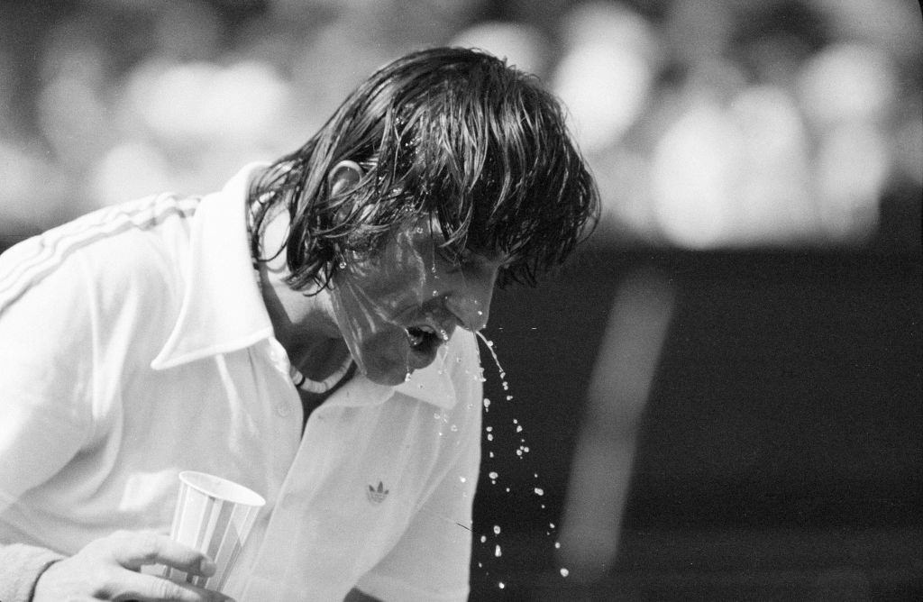 Ilie Nastase, Romanian Tennis Player, feels the heat at Wimbledon Tennis Championships in London.