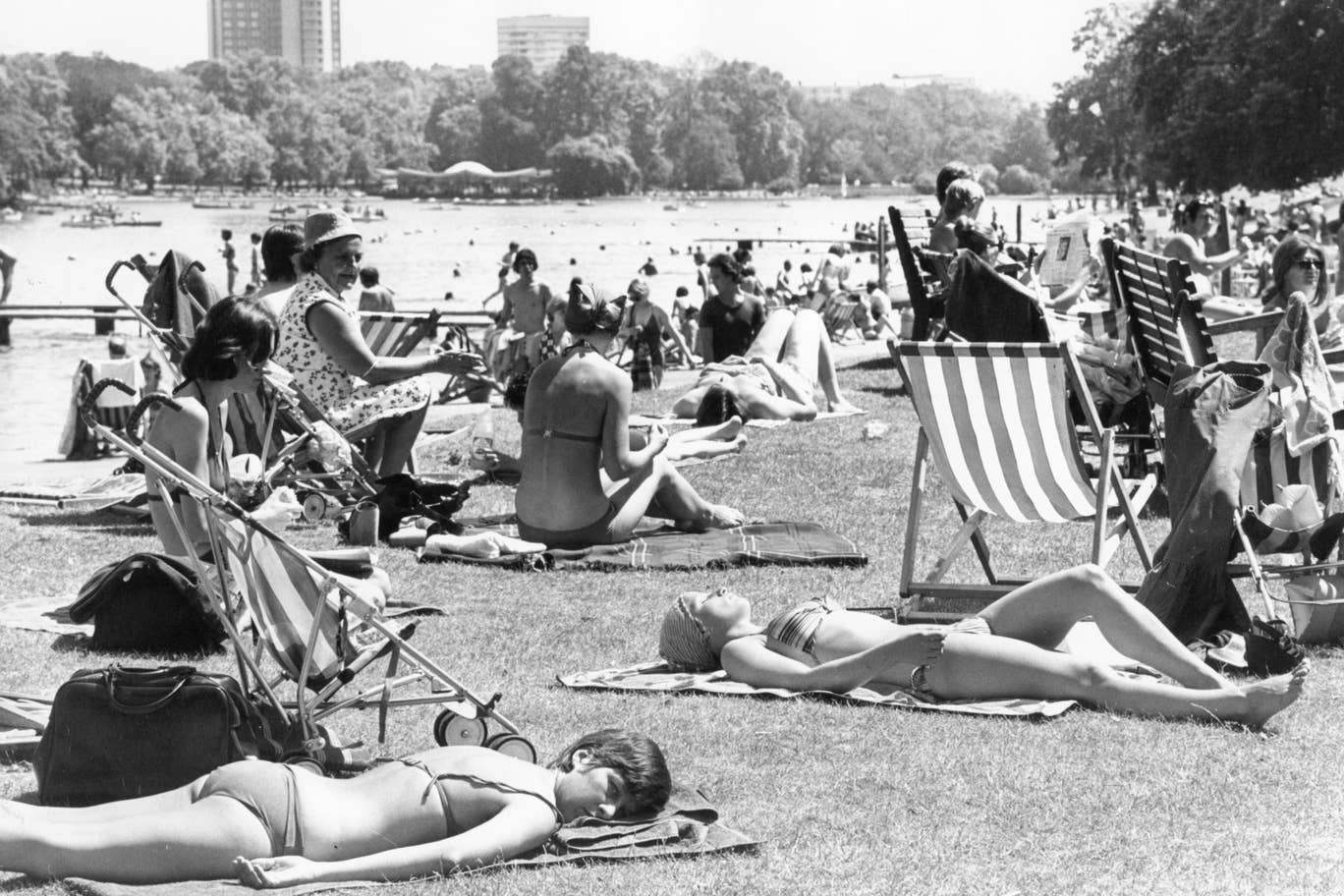 Sunbathers enjoy the heatwave by the Serpentine in Hyde Park