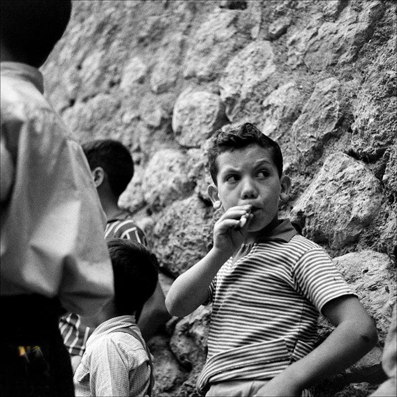 Boy sucking liquorice, 1956