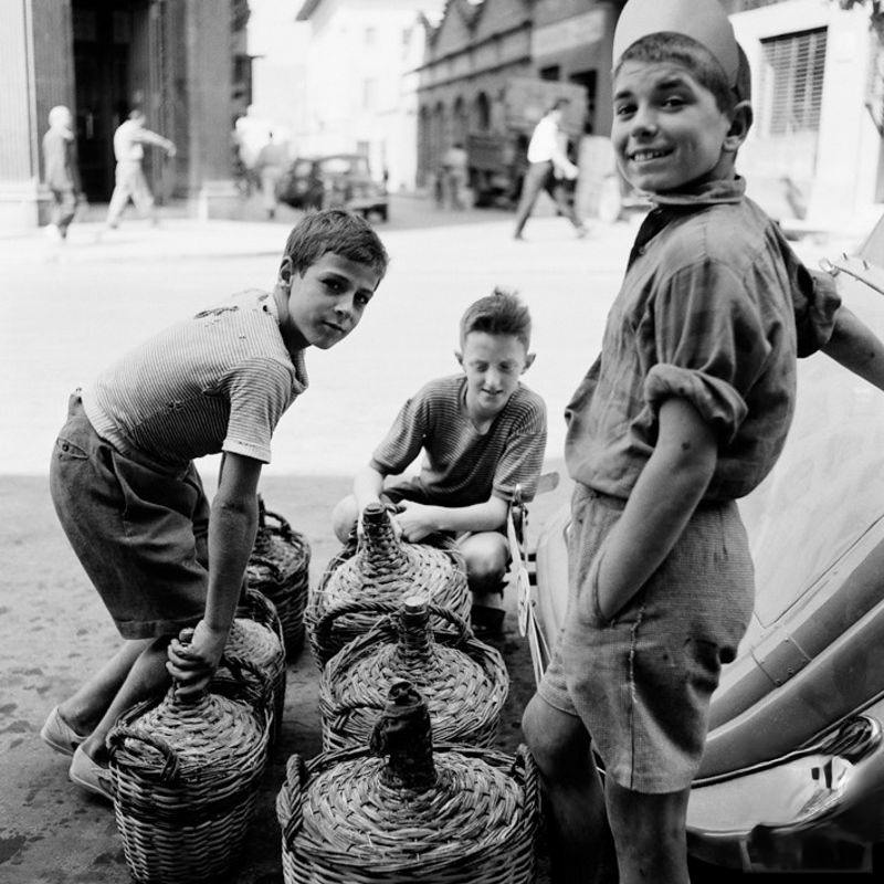 Boys waiting in queue for petrol, 1957