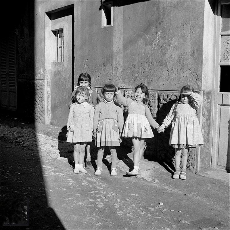 Group of dolls on a street in Palma, 1956