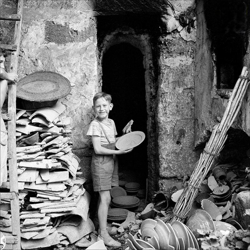 Portrait of a child in a ceramic factory, 1957
