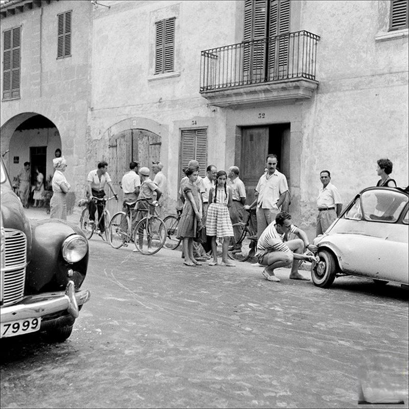 Group of people around a broken car, 1956