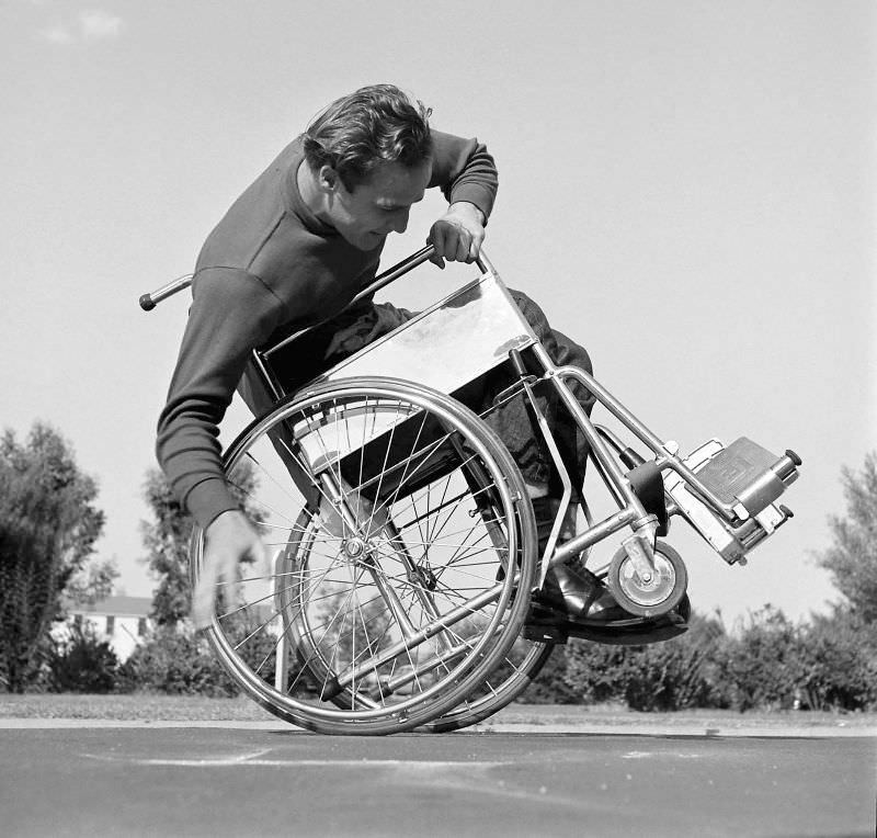 Marlon Brando attempts to tip and balance his wheelchair, 1949.