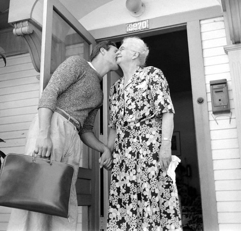 Marlon Brando kisses his grandmother as he heads to the studio for a day of filming 'The Men,' 1949.
