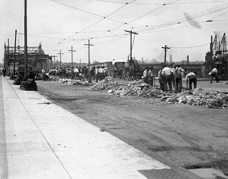 New Bedford-Fairhaven Bridge being repaired. Work men with bridge torn up, 1912