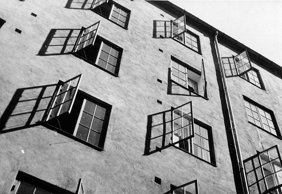 Open apartment windows during summertime heat in Oslo, Norway, 1955.