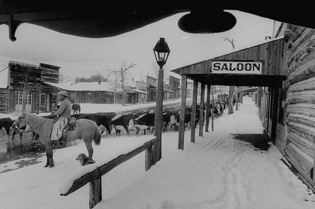 Main Street of this ressurected ghost town, cattle being driven through it, as in the olden days.