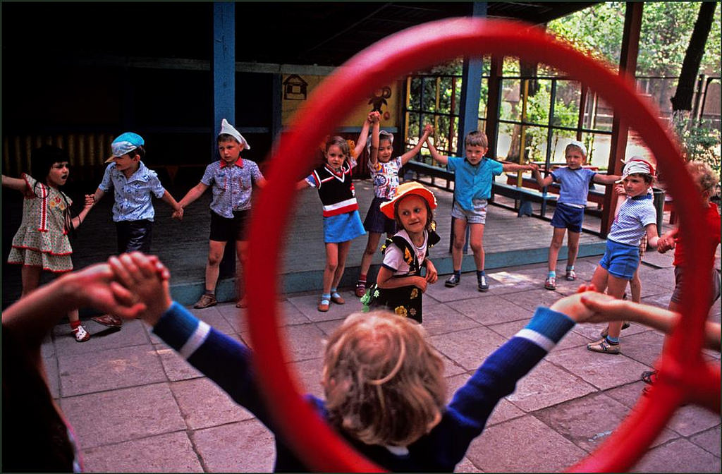Children playing the local version of "Ring a ring of roses" in a government kindergarten.