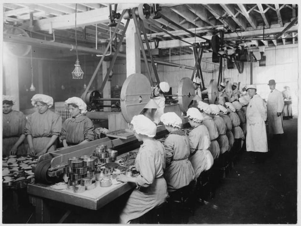 Workers package chipped beef at a meat packing establishment in South Omaha, Nebraska, 1910.