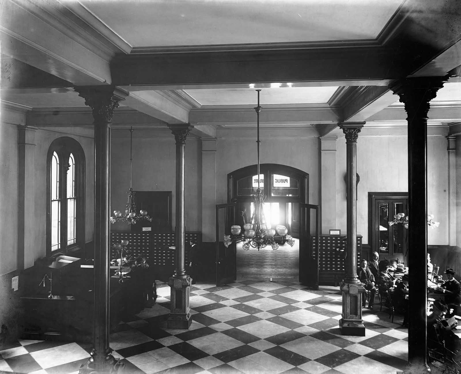 A glimpse of the Main Hall can be seen through vestibule.