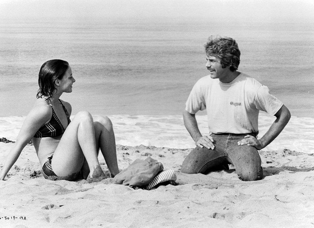 Sam Elliott with Kathleen Quinlan on the beach, 1976