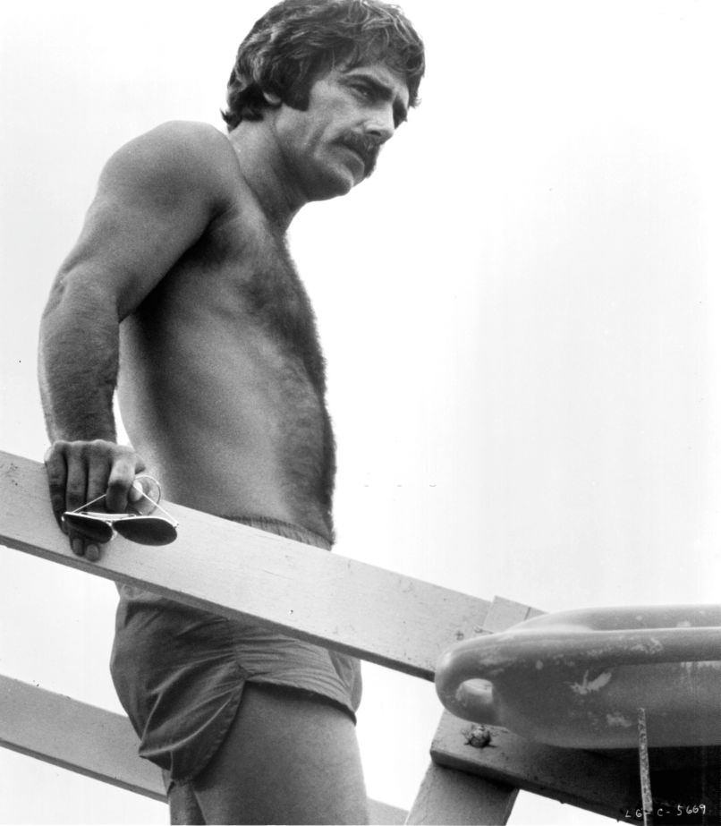 Sam Elliott on lifeguard tower in a scene from the film 'Lifeguard', 1976.