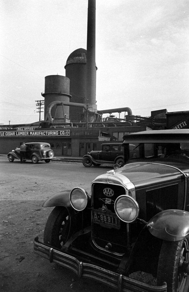 Vehicles parking in front of the Seattle Cedar Lumber Manufacturing Company, Salmon Bay, Seattle,1939