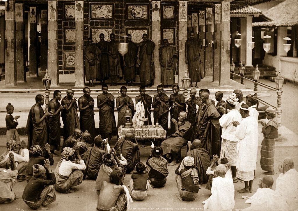 Buddhist monks and worshippers gather at Anoy, Sri Lanka, for the exposition ceremony of the Buddha's tooth, 1880s.