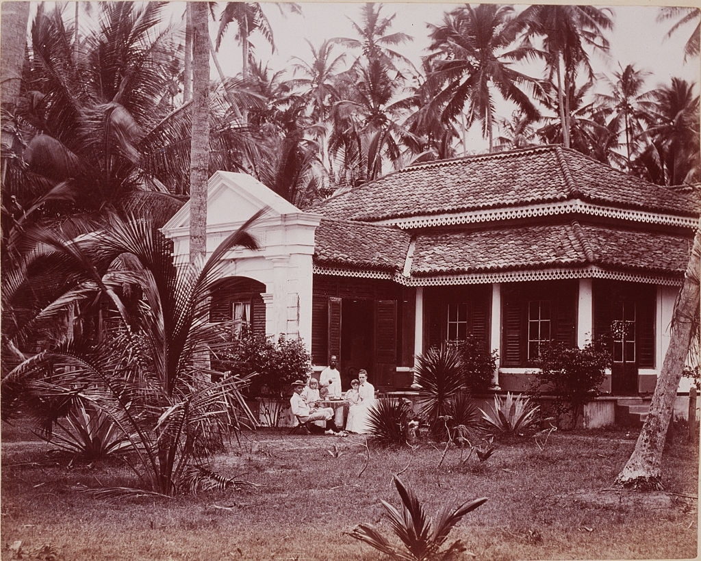 A white family taking tea on the lawn of their estate in Ceylon, 1880s.