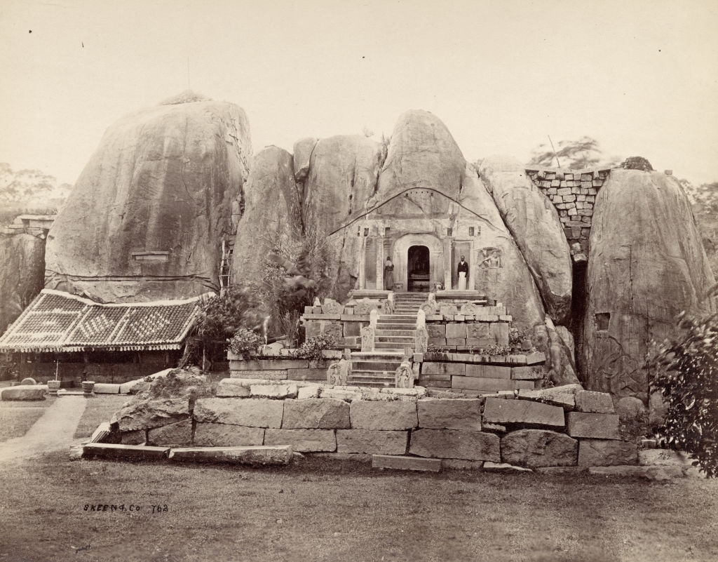 A ruined Buddhist temple carved from a rock at Anuradhapura, Sri Lanka, 1880s.