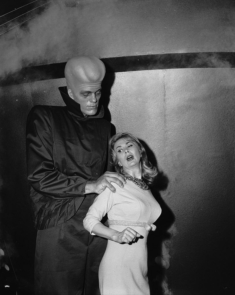 Richard Kiel grabs actress Susan Cummings from behind in a scene from the 'To Serve Man' episode of 'The Twilight Zone,' March 2, 1962.