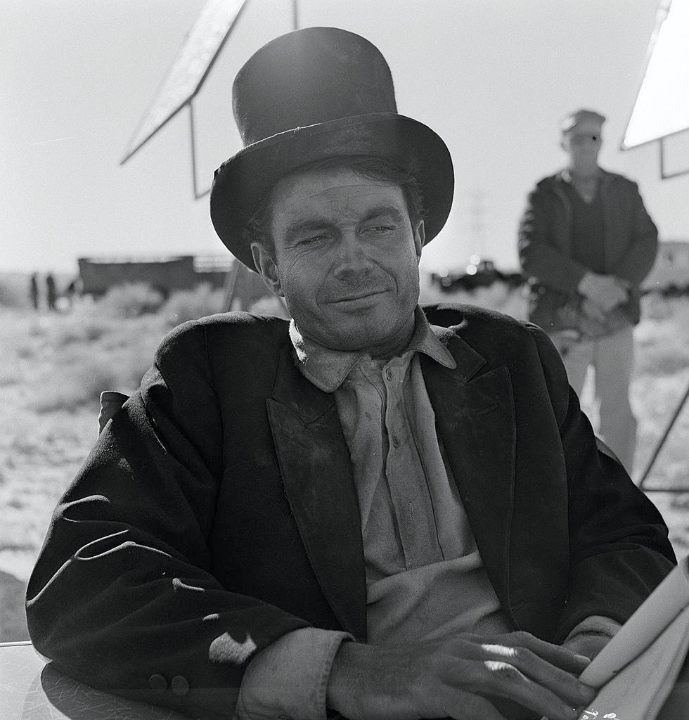 Cliff Robertson relaxes on the set of an episode of the television show 'The Twilight Zone' entitled 'A Hundred Yards Over the Rim', 1961.