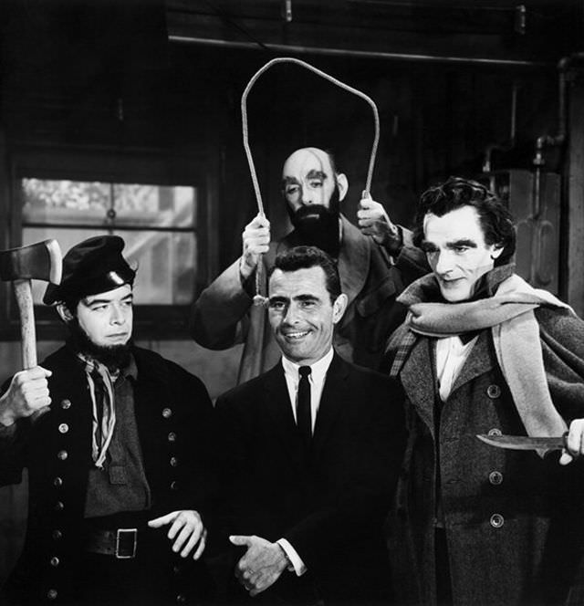 Serling cracks a smile surrounded by his sinistar stars in season four's “The New Exhibit,” Robert Mitchell, Milton Parsons and David Bond.