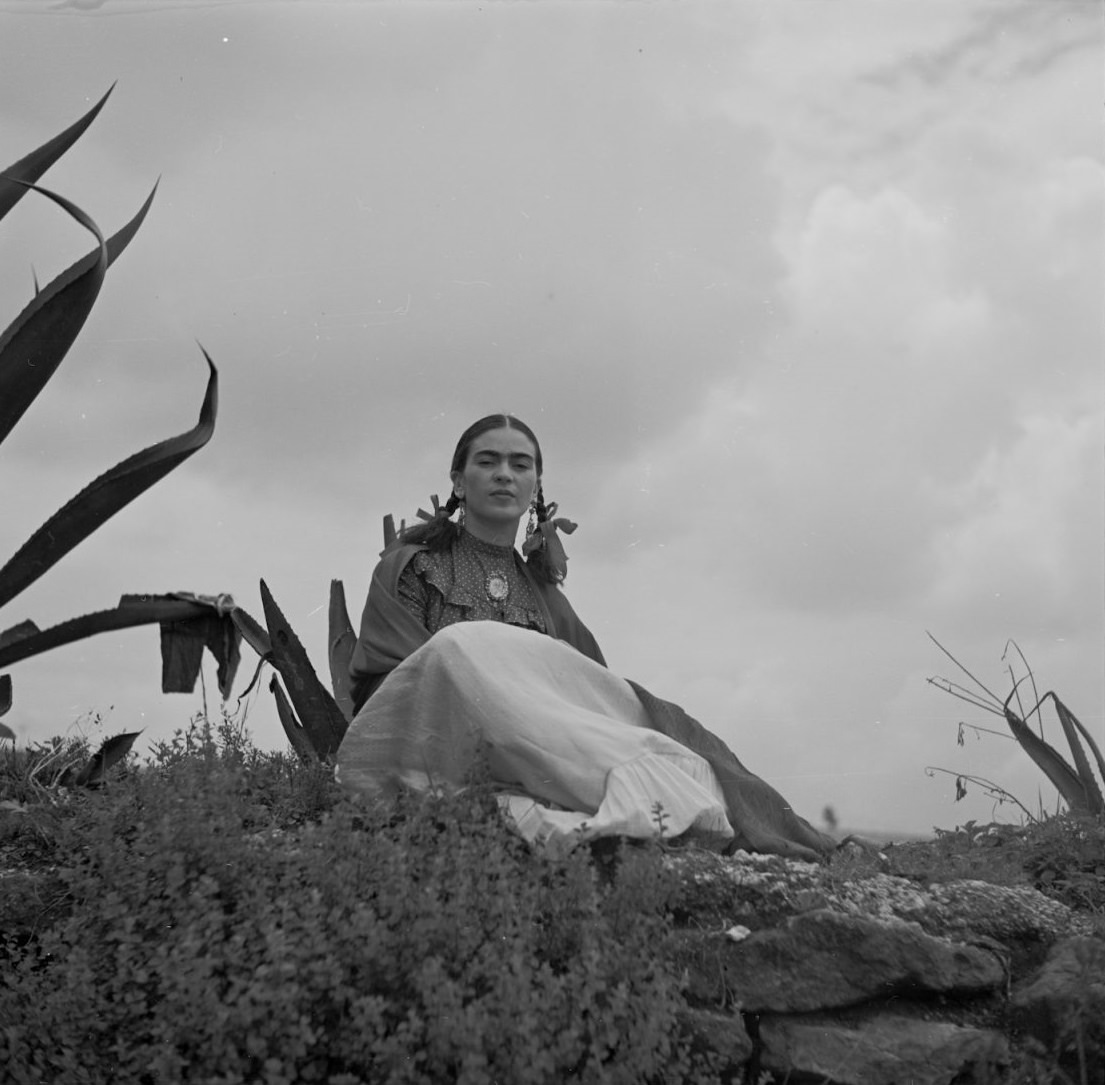 Frida Kahlo seated next to an agave, 1937.