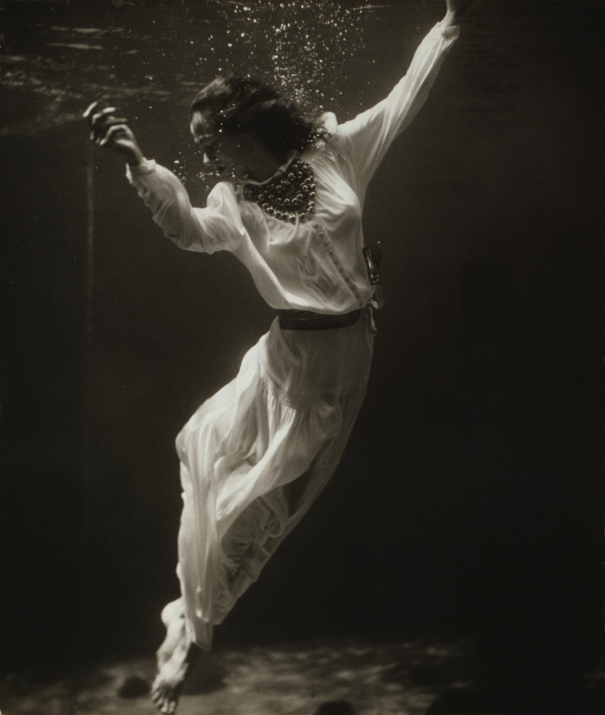 Fashion model underwater in dolphin tank Marineland, Florida.