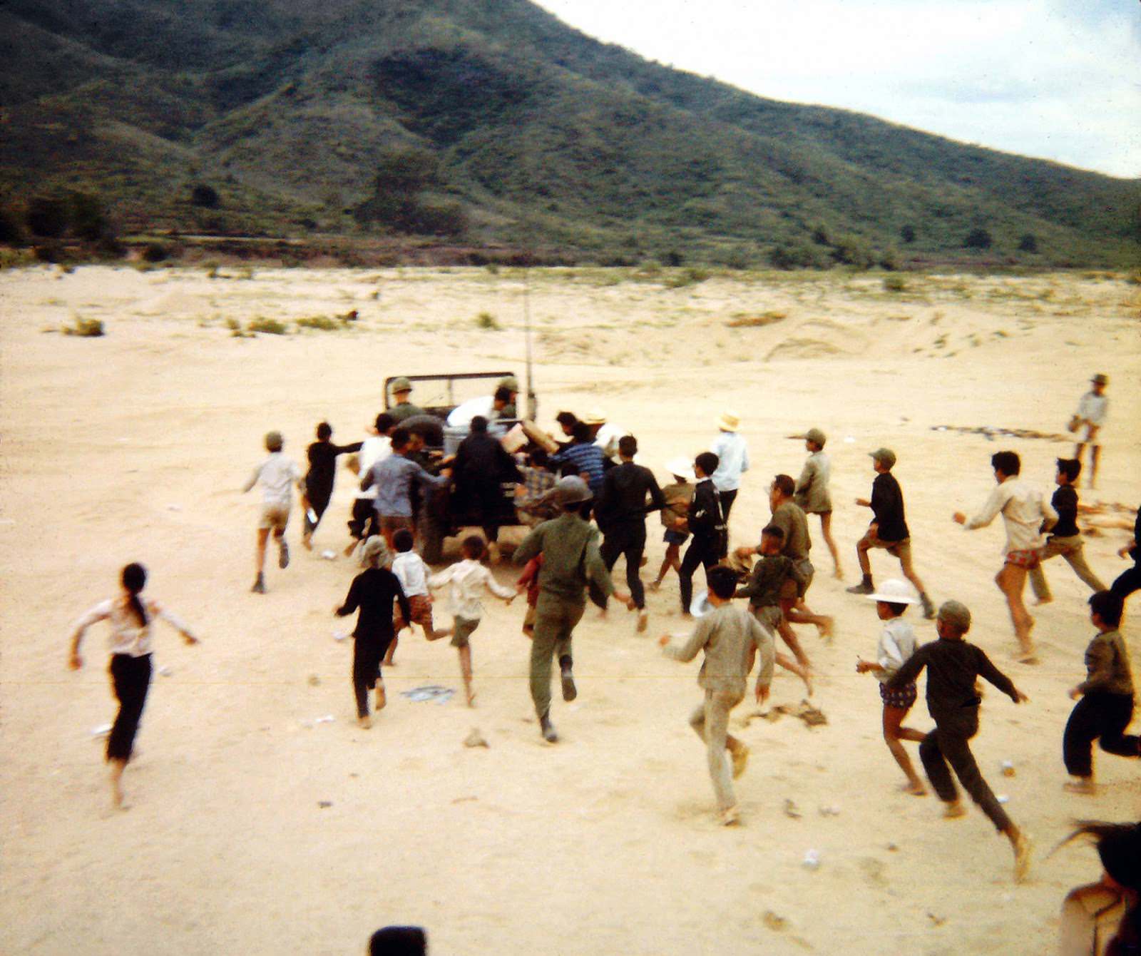 After filling sandbags for bunkers at a base camp by the South China Sea near Ninh Hoa, Vietnam. 1968.