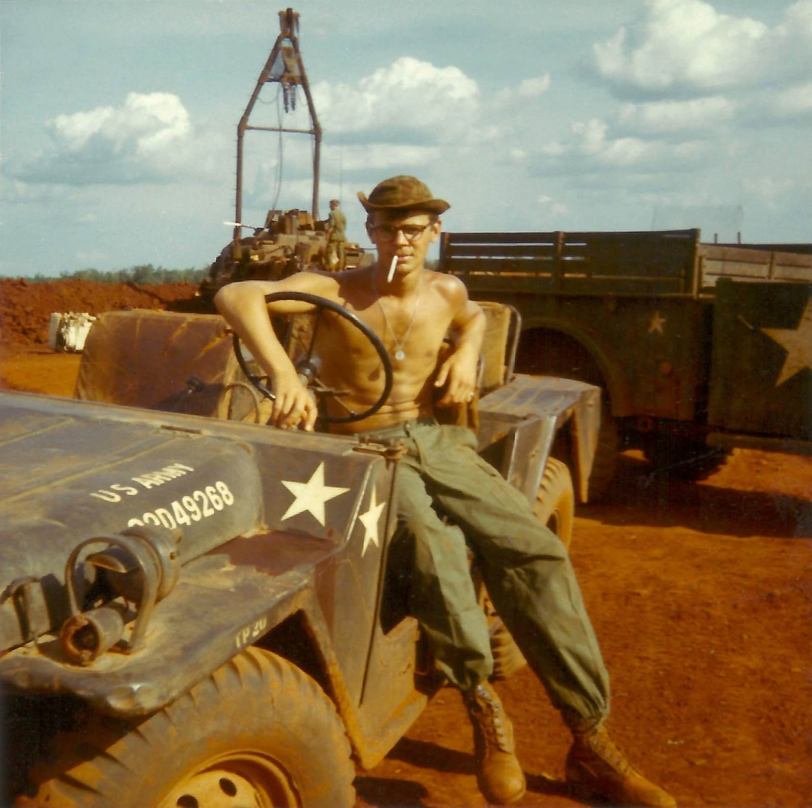 Larry Diesburg taking a smoking break after filling sandbags near Binh Long, Vietnam.