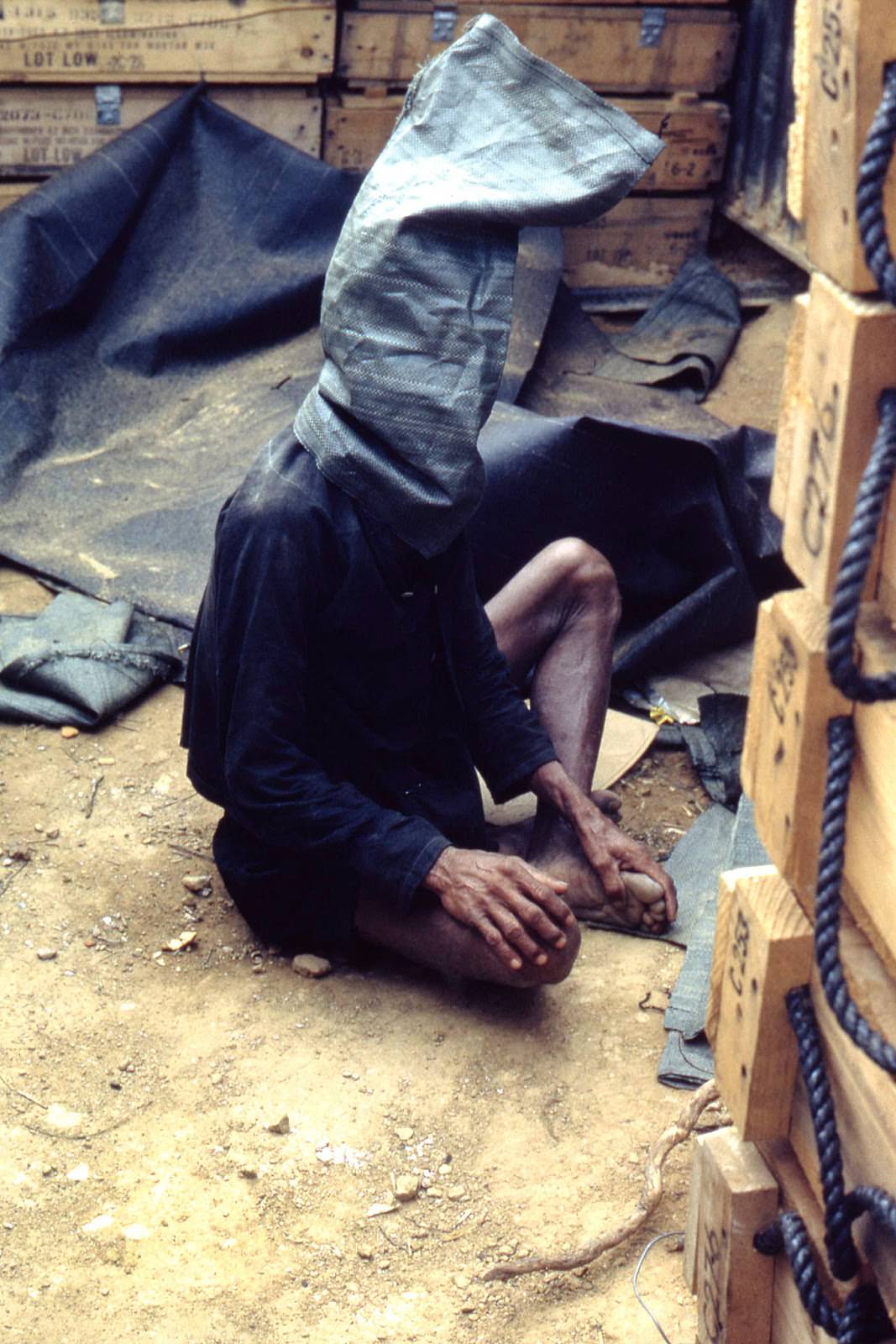 A Viet Cong prisoner held for interrogation at Landing Zone Stinson. Quang Ngai Province, Vietnam.