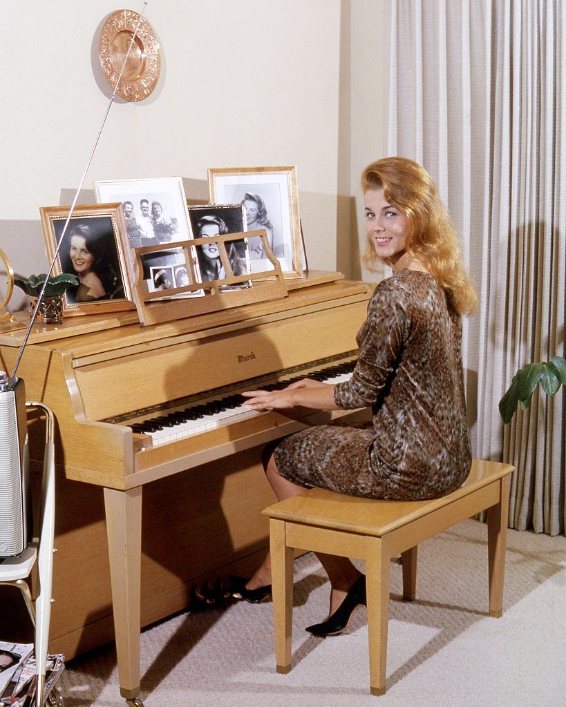 Ann-Margret playing a piano, circa 1964.