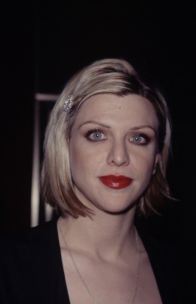 Courtney Love in a black dress.