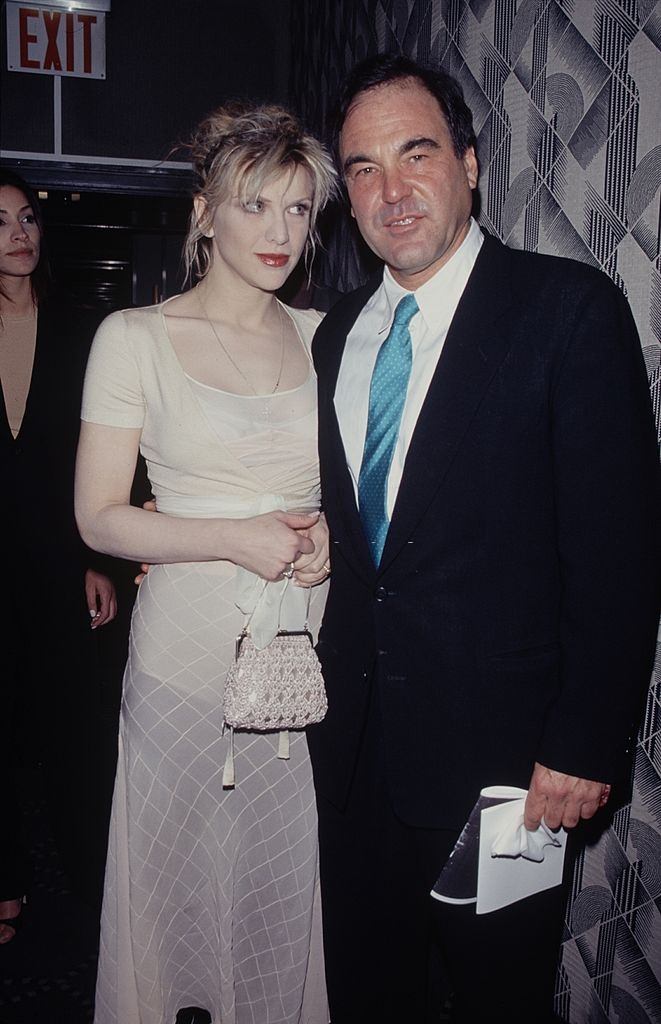 Courtney Love with director Oliver Stone, 1994.