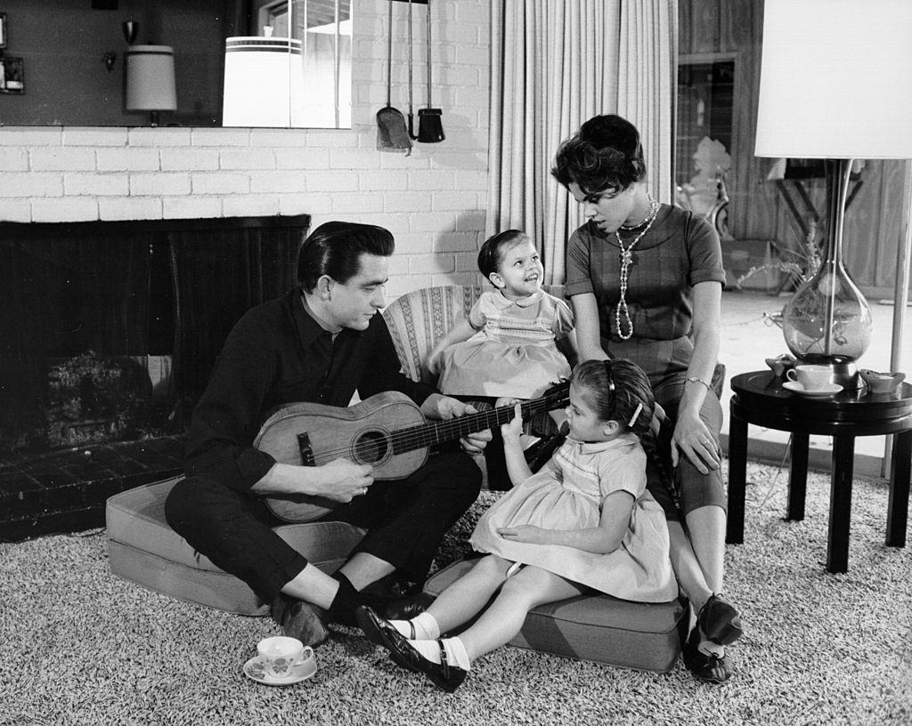 johnny Cash with his wife Vivian Liberto and daughters, Rosanne Cash and Kathy Cash look on in 1957.