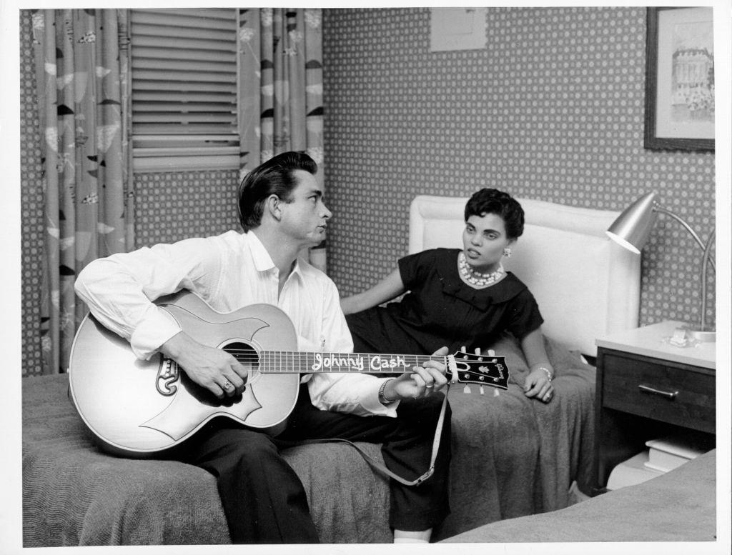 Johnny Cash playing guitar for his wife, Vivian Liberto, 1957.