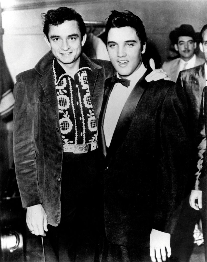 Johnny Cash with Elvis Presley.
