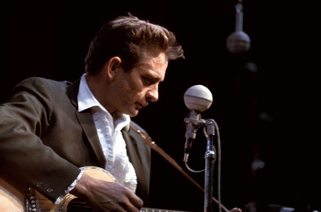 Johnny Cash performing on stage.