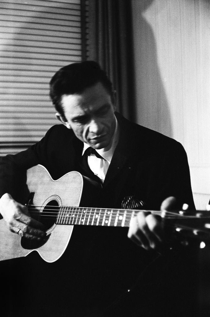 Johnny Cash warms up backstage at the New York Folk Festival in July of 1965
