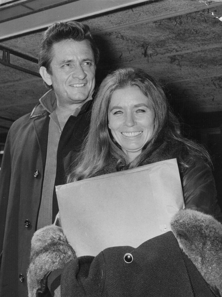 Johnny Cash with his wife June Carter Cash at London Airport, 1968.