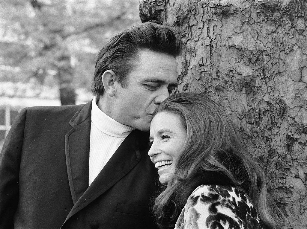 Johnny Cash with his wife June Carter in a London park during their visit to Britai, 1968.