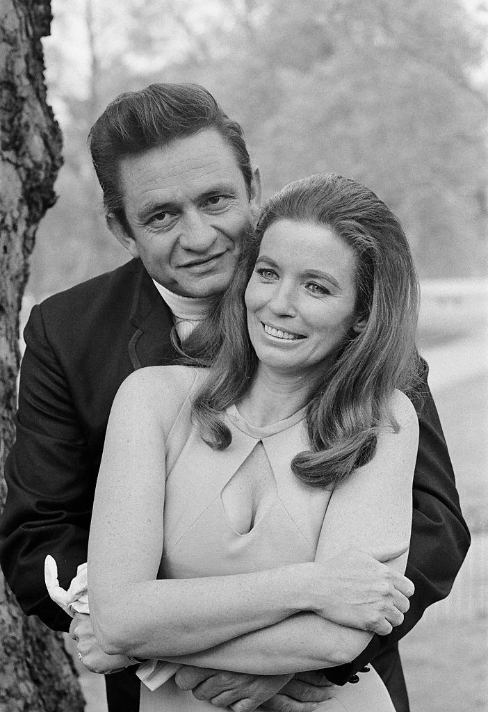 Johnny Cash with his wife June Carter in a London park during their visit to Britai.