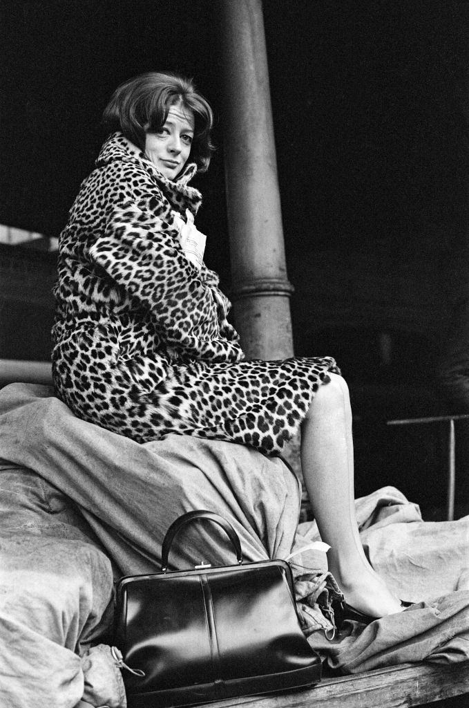 Maggie Smith on a train station platform in London, 1964.