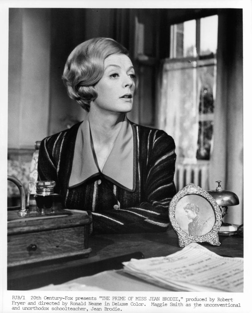 Maggie Smith looking from her desk in a scene from the film 'The Prime Of Miss Jean Brodie', 1969.
