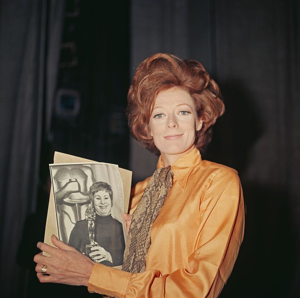 Maggie Smith holding her award, 1970.