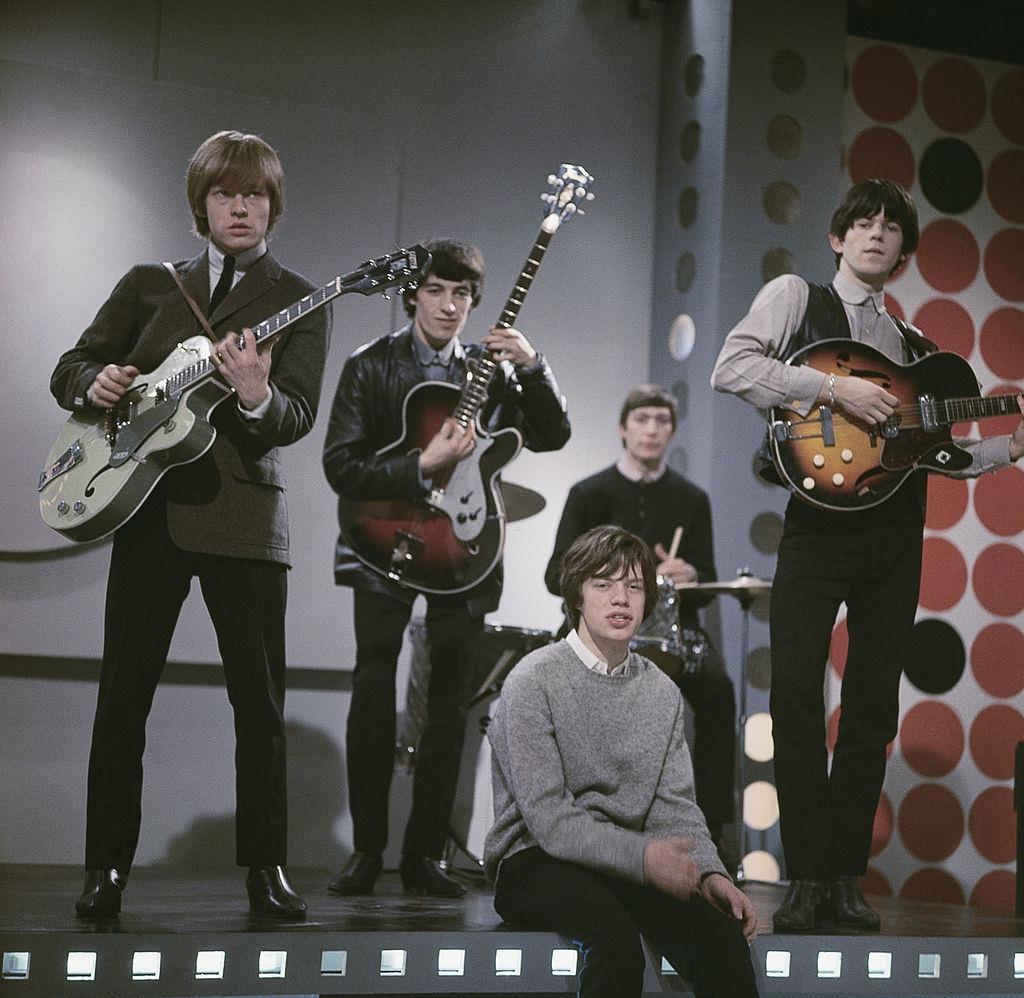 Mick Jagger performing on stage with the member of The Rolling Stones, 1963.