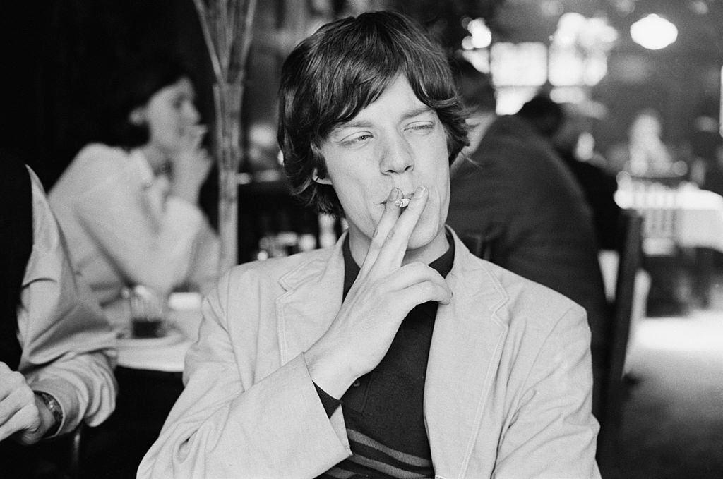 Mick Jagger smoking a cigarette cigarette, 1964.