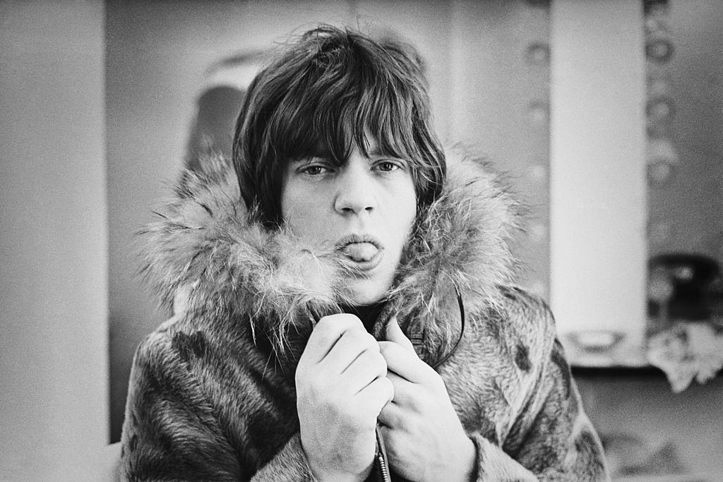 Mick Jagger poking his tongue out for the camera, 1964
