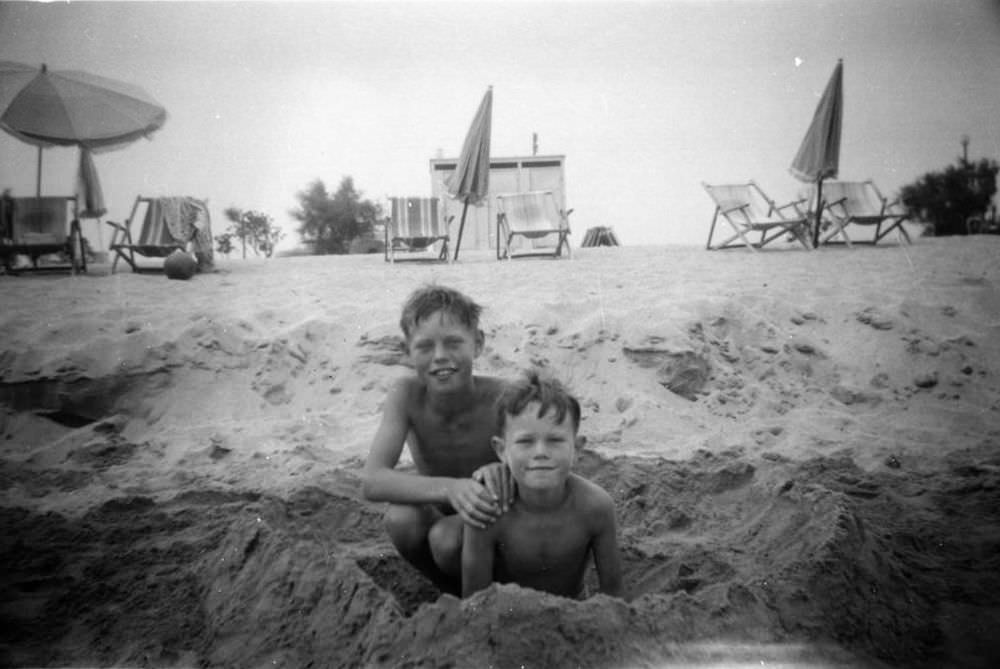 Mick Jagger (left) aged 8, on a family holiday with his younger brother Chris (right) in 1951.