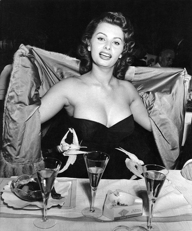 Sophia Loren in a strapless dress and fur stole at Berlin Film Festival