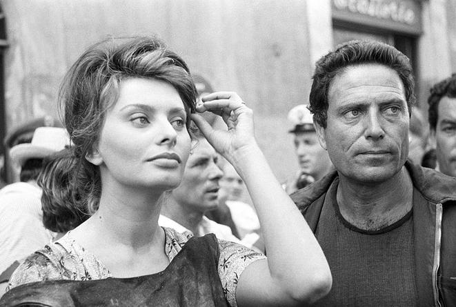 Sophia Loren with Raf Vallone before appearing in a movie scene, 1960.